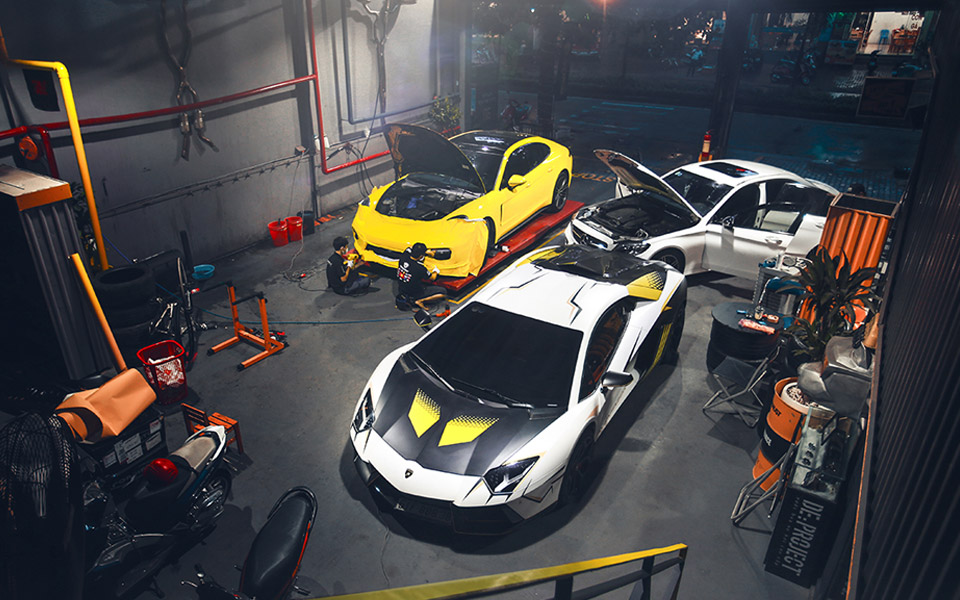 Three supercars in garage